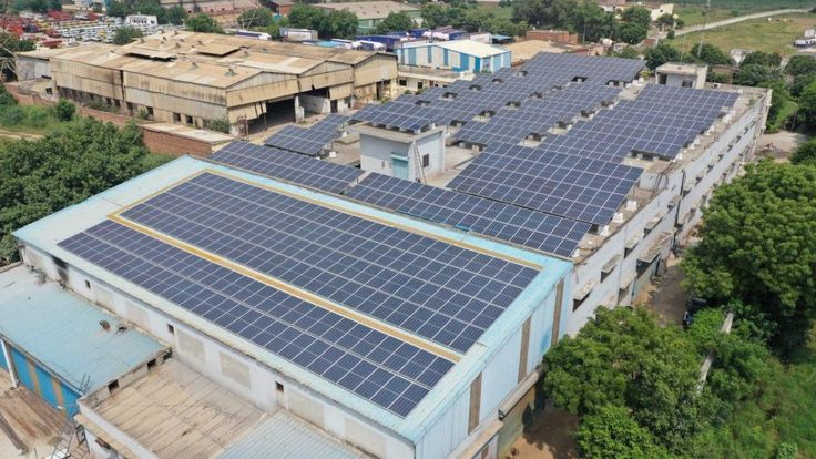 Trinidad commercial building with solar panels — replace with real photo from media library